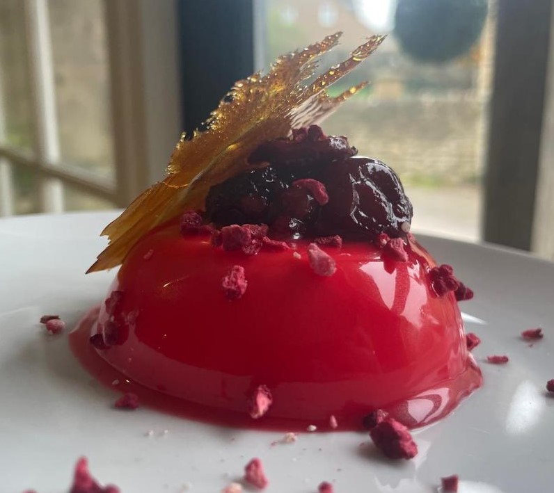 Glazed berry dessert with caramel tuile