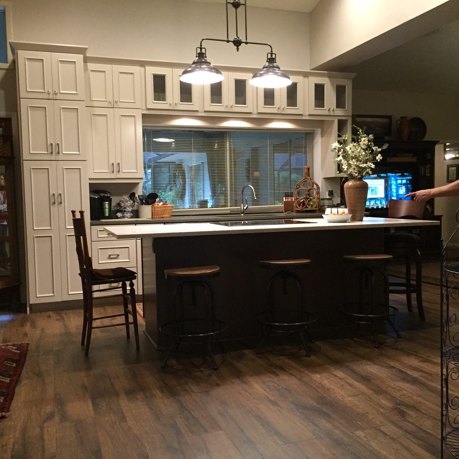 Kitchen remodel with white cabinetry and island seating, Tampa Bay