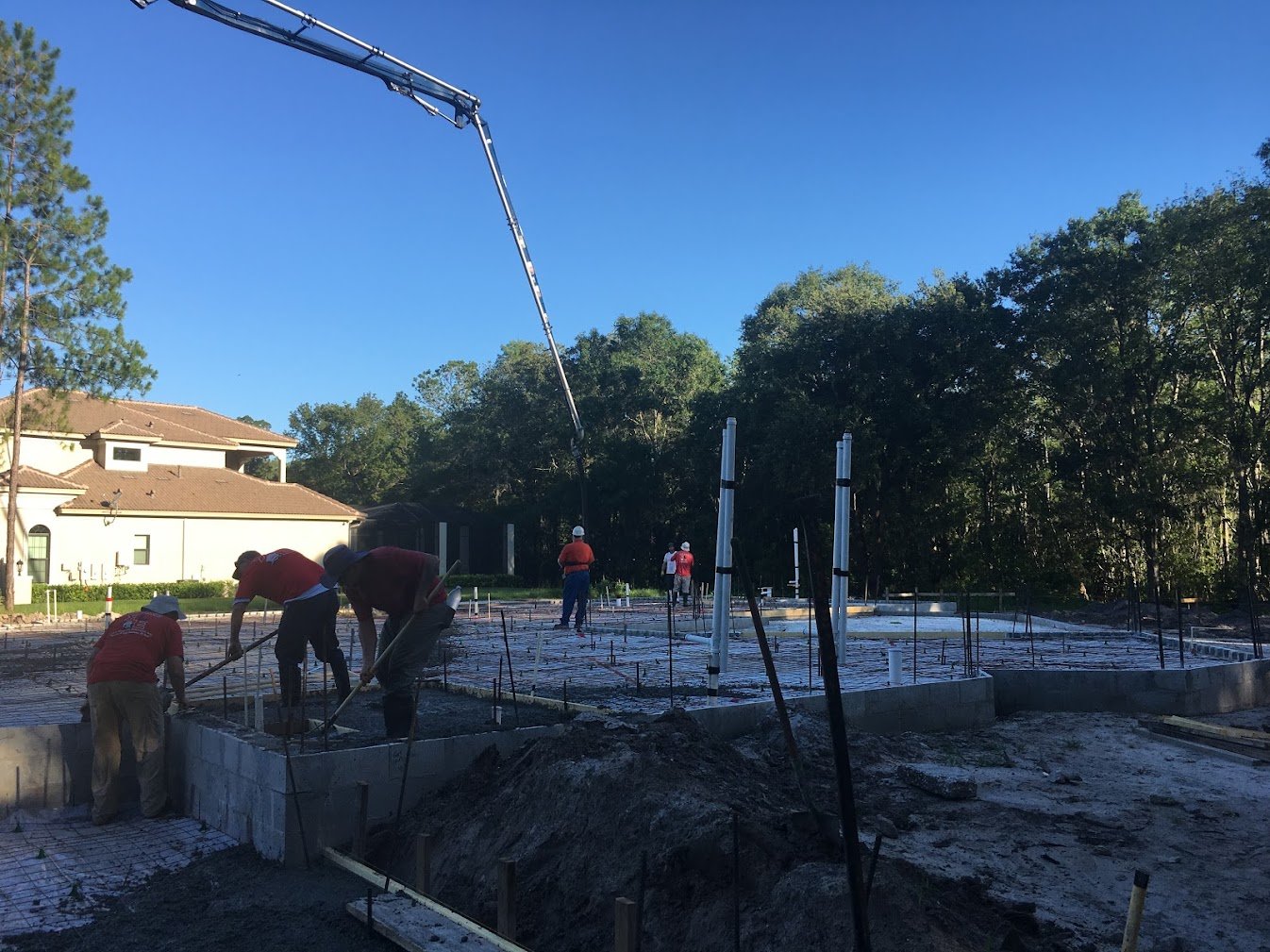Crew pouring the slab for a custom home, Tampa Bay