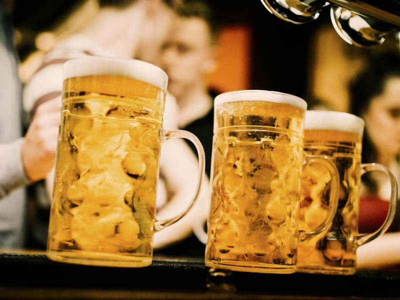Full Oktoberfest beer steins on the bar