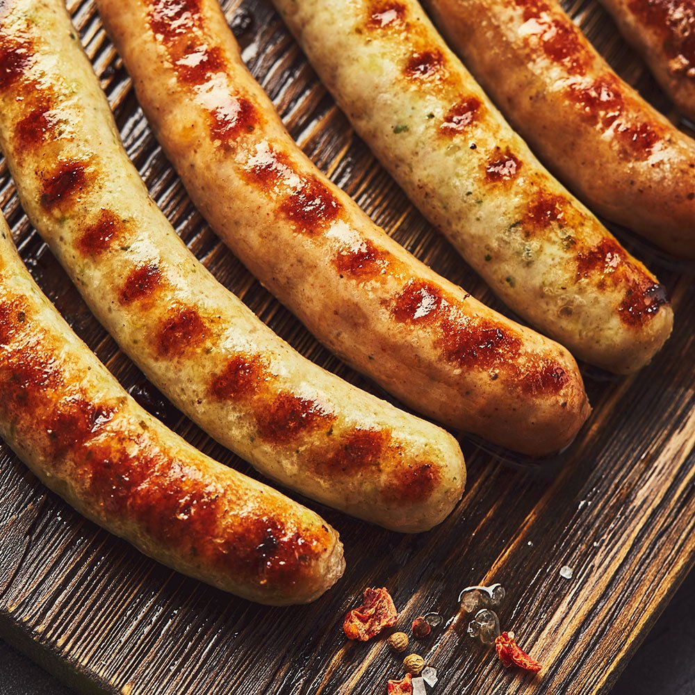 Grilled Oktoberfest bratwurst sausages on a board