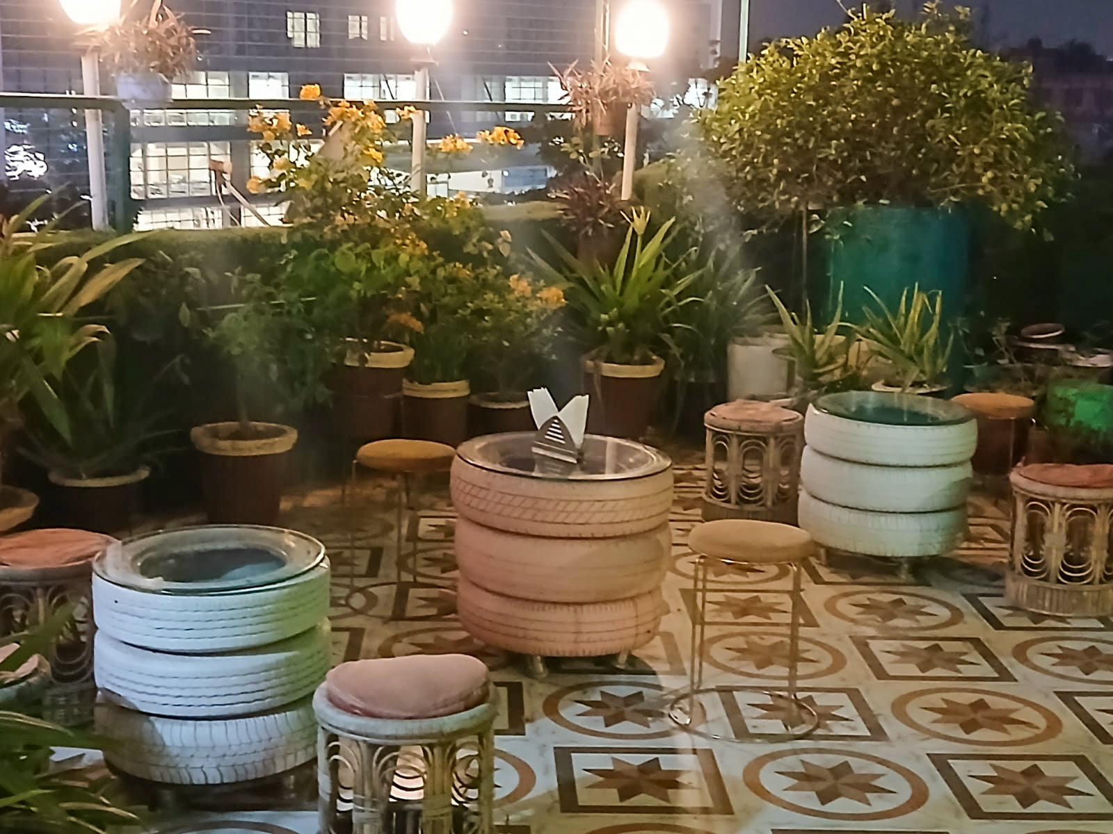 ROOFTOPz fine-dining table setting with terracotta wall art, Patna