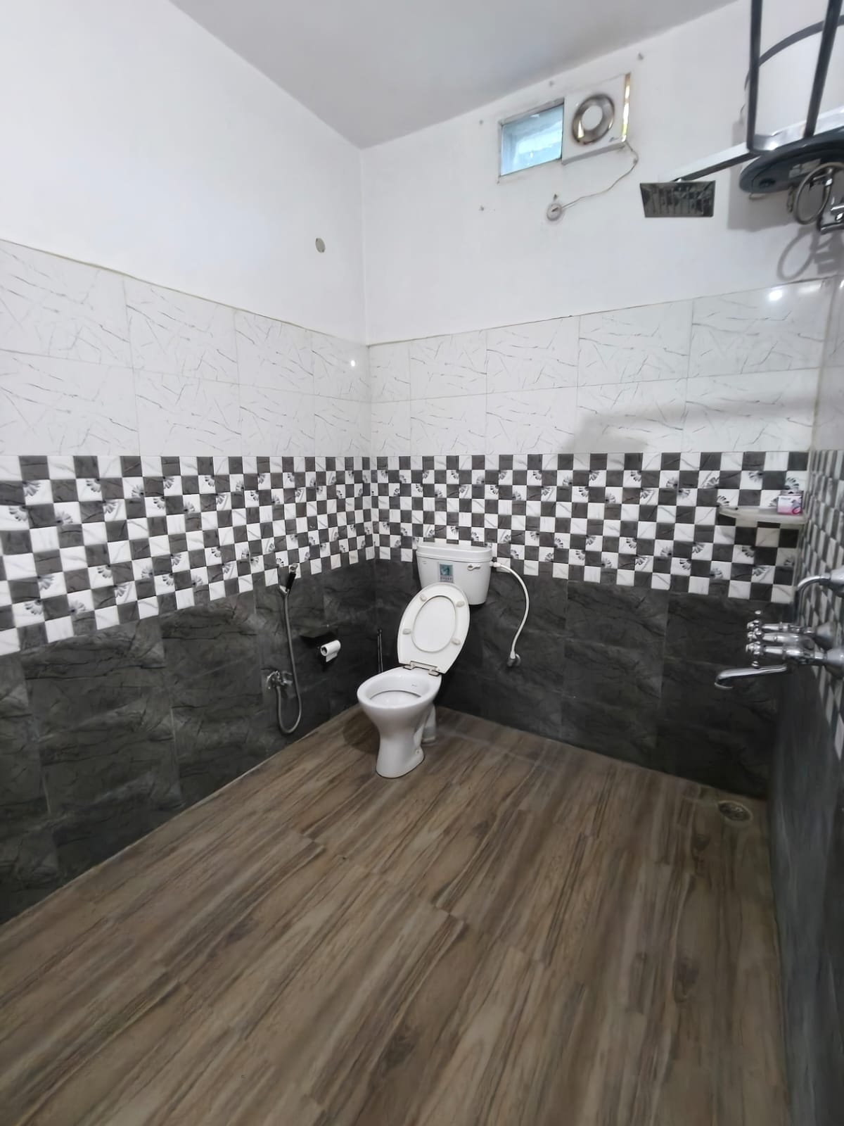 Clean attached bathroom in AC Premium room, Patna