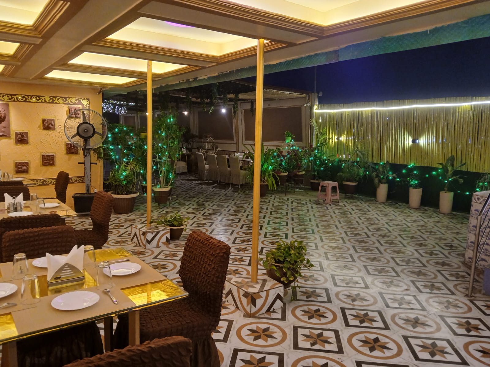 Terrace dining with green ambient lights at ROOFTOPz Patna