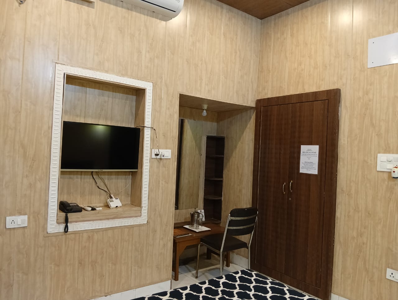 Hotel room with TV, wardrobe and work desk, Hotel Virasat Retreat Patna