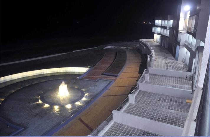Fountain plaza lit up at night - Sagar Darshan Guest House, Somnath
