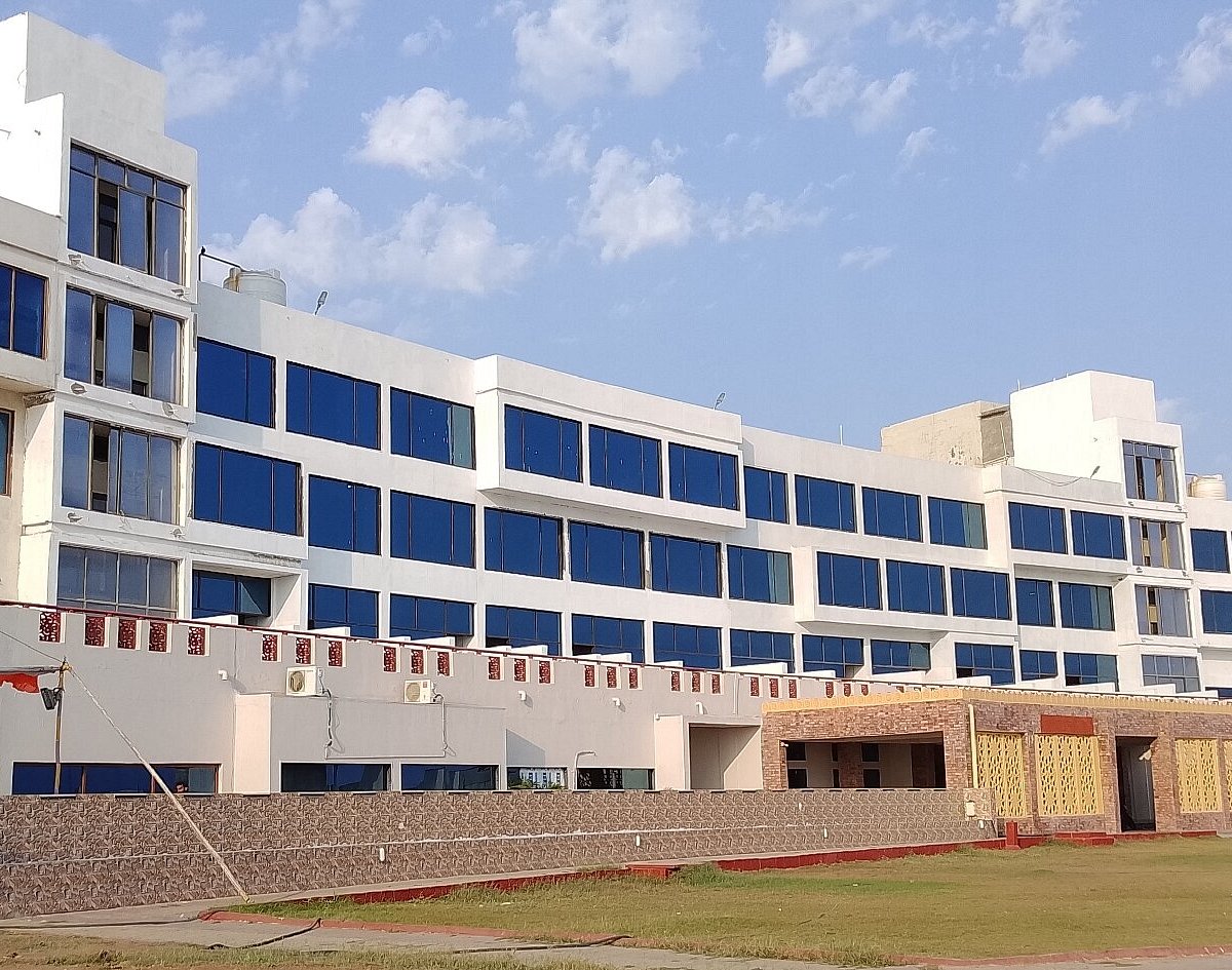 Guest house facade with blue-tinted sea-facing windows - Sagar Darshan Guest House, Somnath